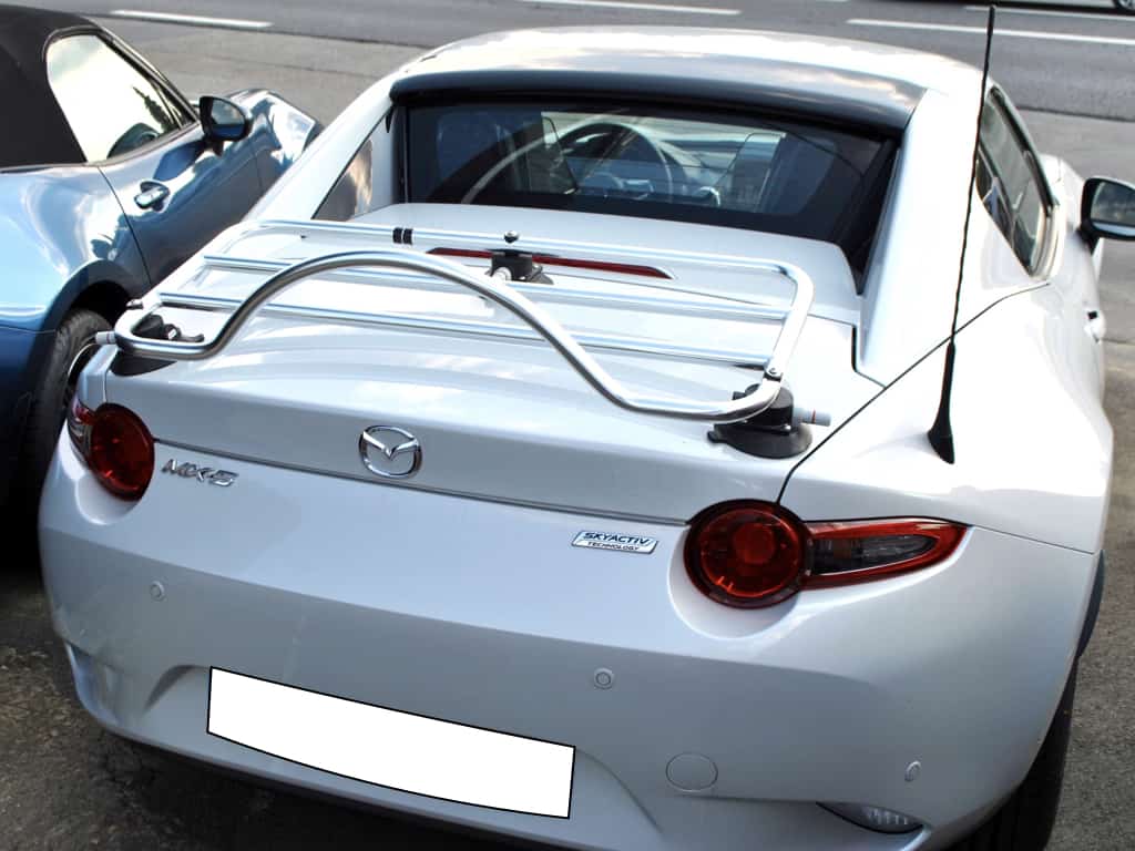 white mazda mx5 RF with a stainless steel luggage rack fitted