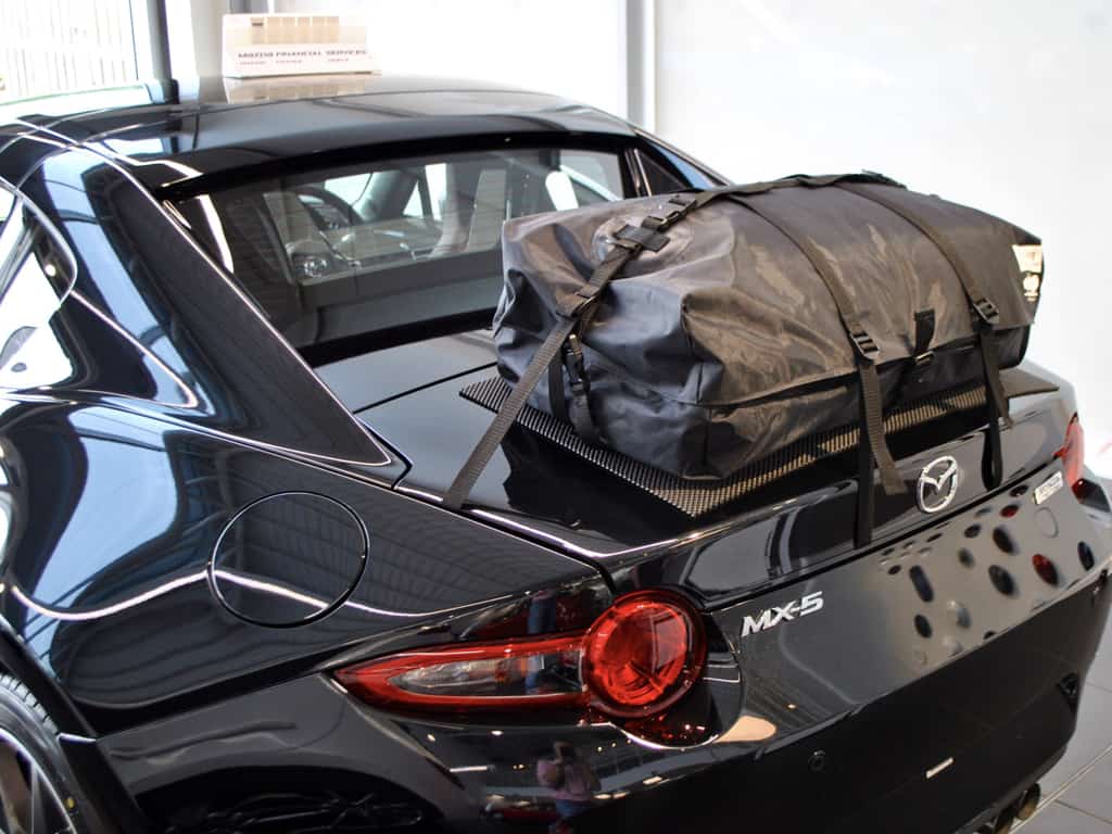 rear view of a black mazda mx5 rf with a boot-bag original luggage rack fitted