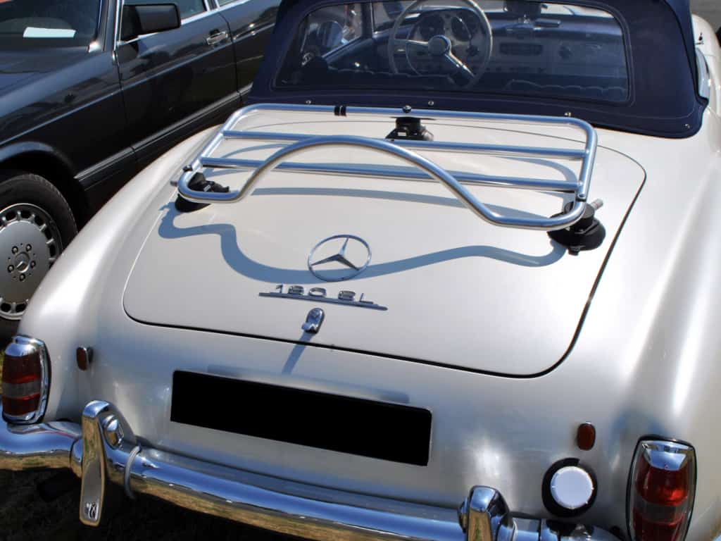 silver mercedes 190sl in a car park with a revo-rack luggage rack fitted