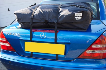 rear view of a blue mercedes benz r170 230 Kompressor with a boot-bag vacation luggage rack fitted