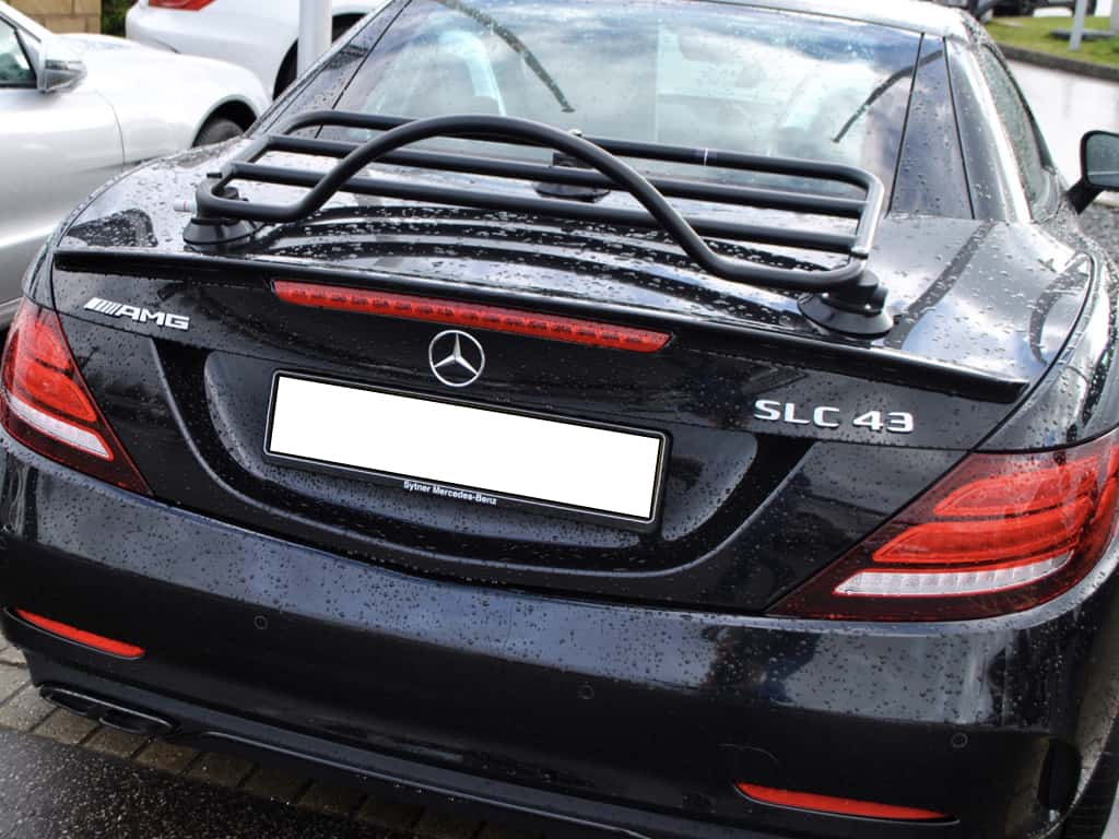 black mercedes benz slk 43 AMG with a black luggage rack fitted