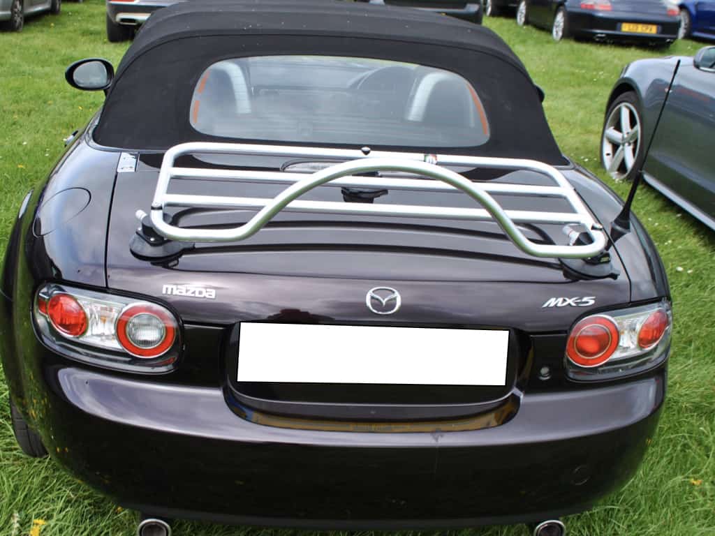 mazda mx5 mk3 in dark red with a revo-rack pa luggage rack fitted to the boot lid