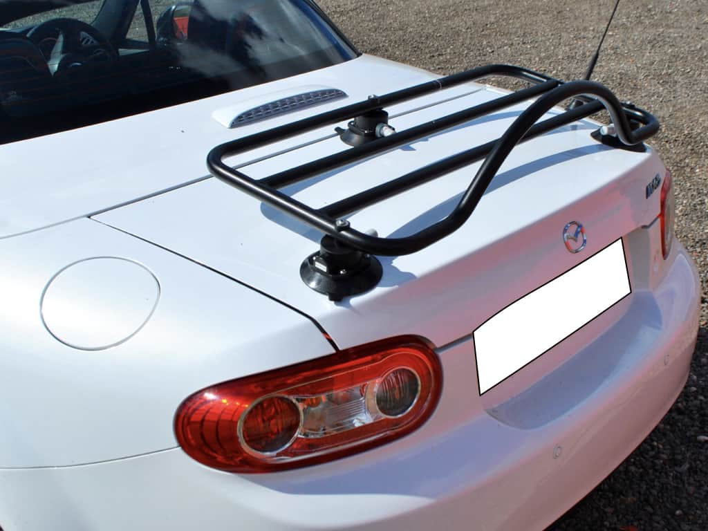 white mazda mx5 mk3 roadster coupe with a black revo-rack luggage rack fitted