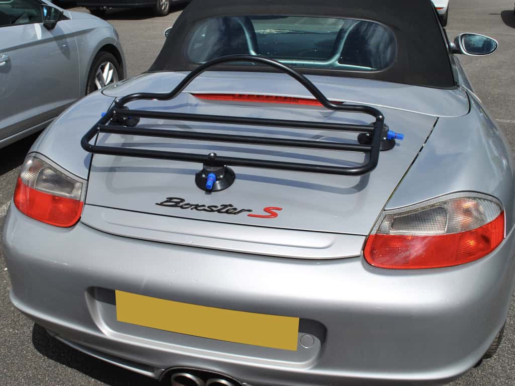 silver porsche boxster 986s with a revo-rack luggage rack fitted photographed from the rear on a sunny day