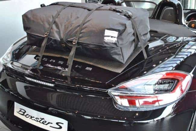 black porsche boxster s with a boot-bag vacation luggage bag fitted