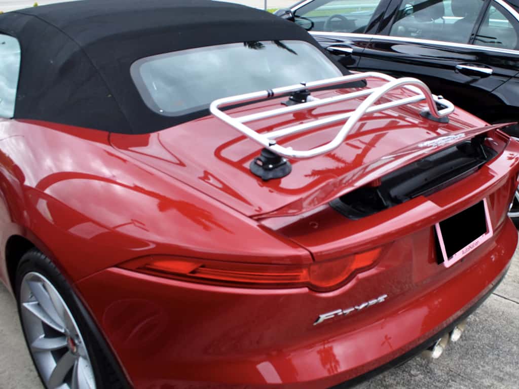 red Jaguar f type convertible with a revo-rack polished chrome luggage rack fitted to the boot spoiler up