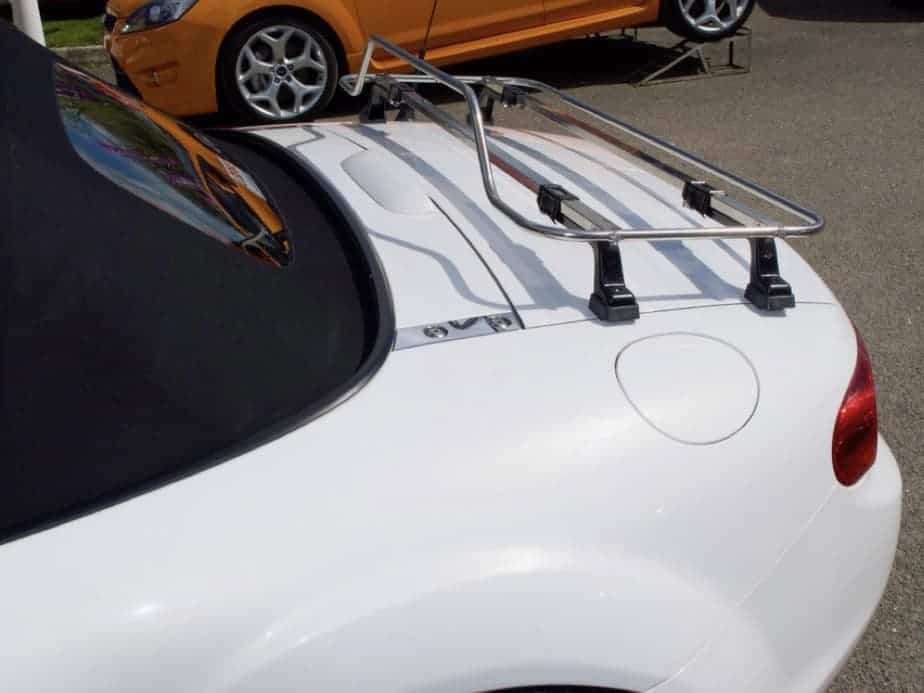 Side view of a stainless steel luggage rack fitted to a white mazda mx5 mk3