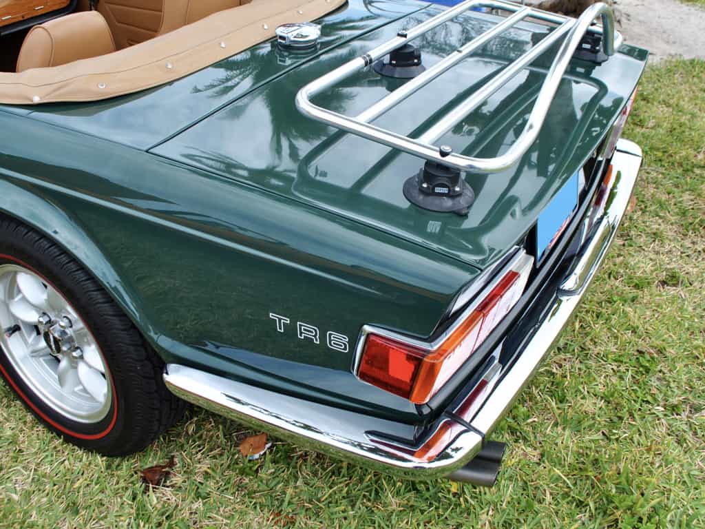 side view of a revo-rack PA luggage rack fitted to a british racing green triumph tr6