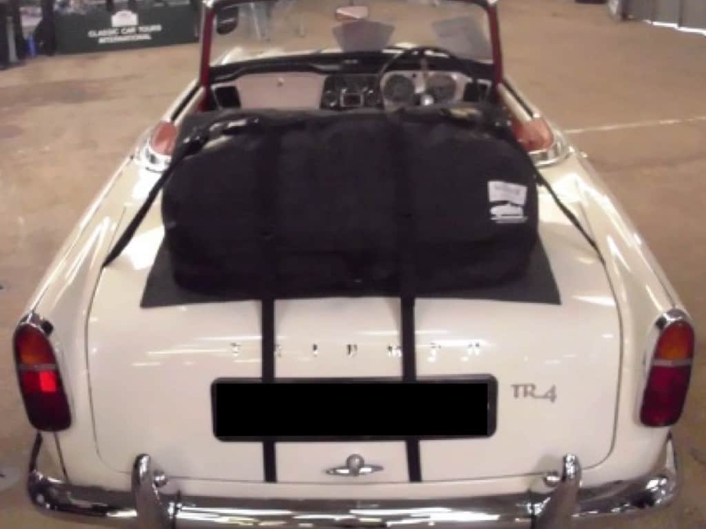 white triumph tr4 with a boot-bag original luggage rack fitted 