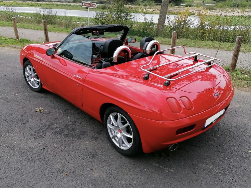 aerial view of a fiat barchetta roof down with a stainless steel luggage rack fitted