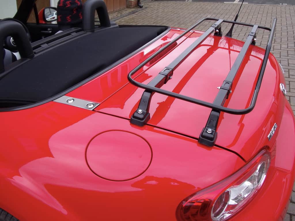 close up of a red mazda mx5 nc with a black luggage rack fitted