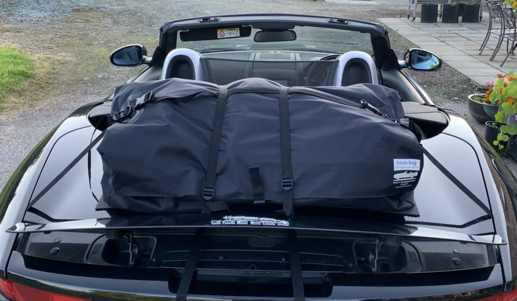black Jaguar f type convertible with a boot-bag luggage rack fitted photographed close from the rear