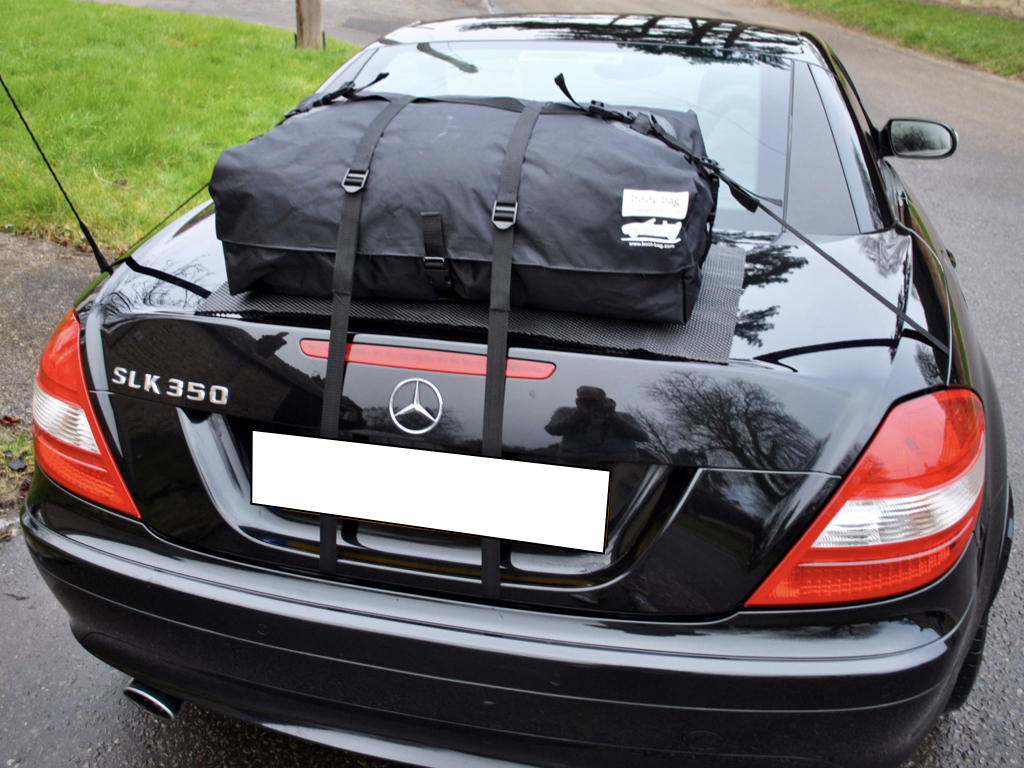 black mercedes slk 350 with a boot-bag luggage rack fitted photographed from the rear