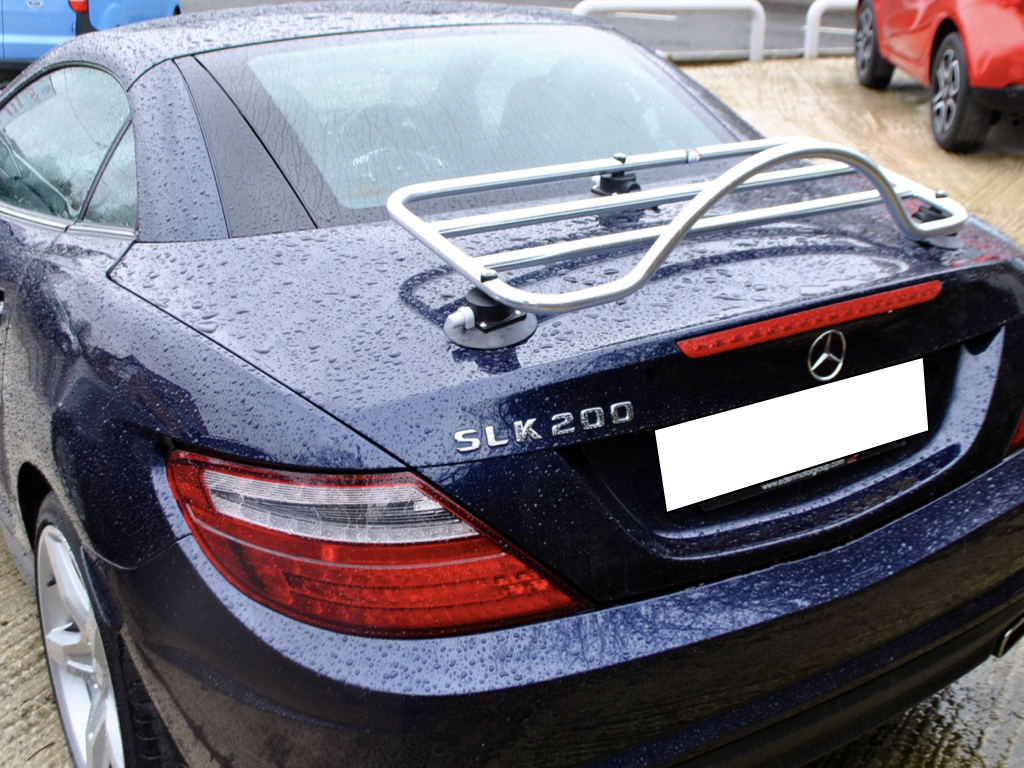 blue mercedes slk 200 r172 with a revo-rack pa luggage rack fitted in the rain photographed from the rear 
