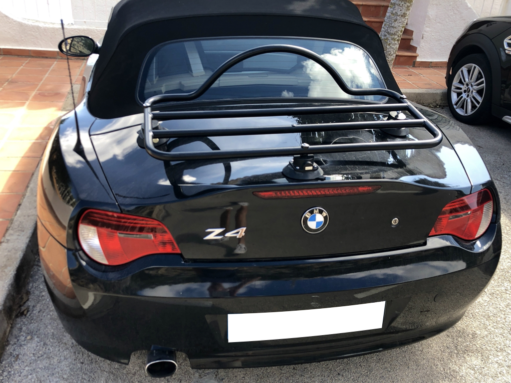 rear view of a black bmw z4 e85 with a luggage rack fitted to the boot lid