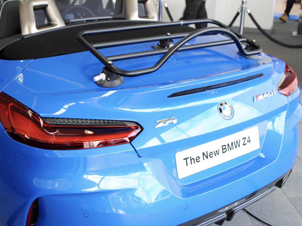 blue bmw z4 g29 m40i in a bmw showroom with a revo-rack luggage rack fitted 
