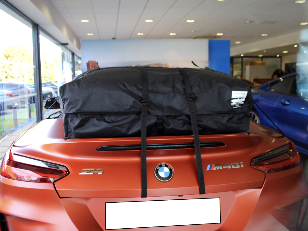bmw z4 m40i in bronze in a bmw showroom with a boot-bag luggage rack fitted 