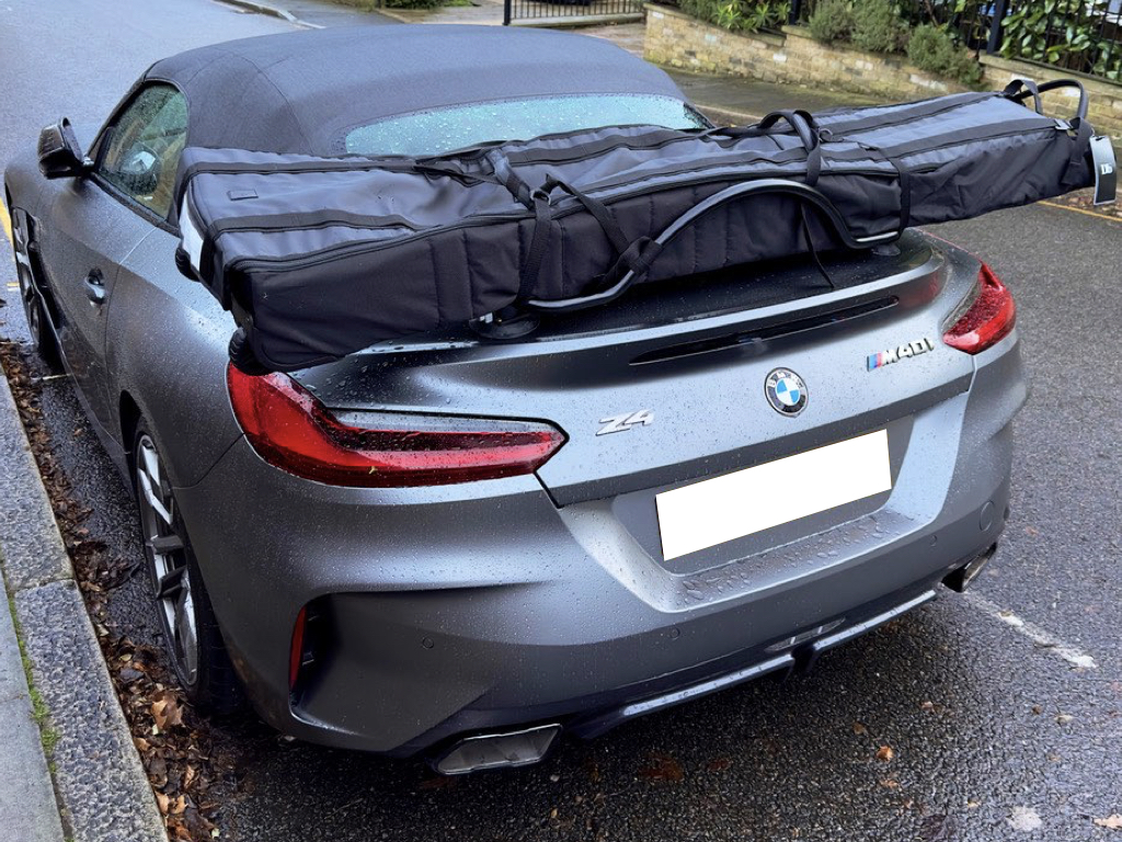 grey bmw z4 g29 m40i with a revo-rack luggage rack fitted carrying a ski bag