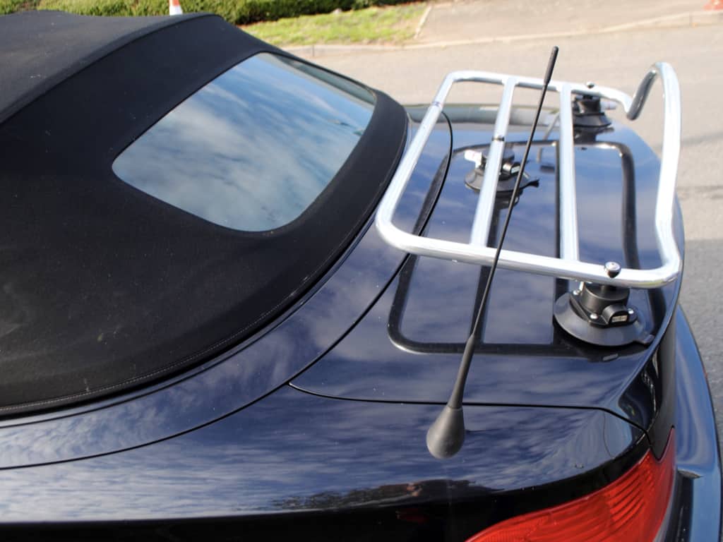 BMW 1 Series convertible with hood up and luggage rack attached