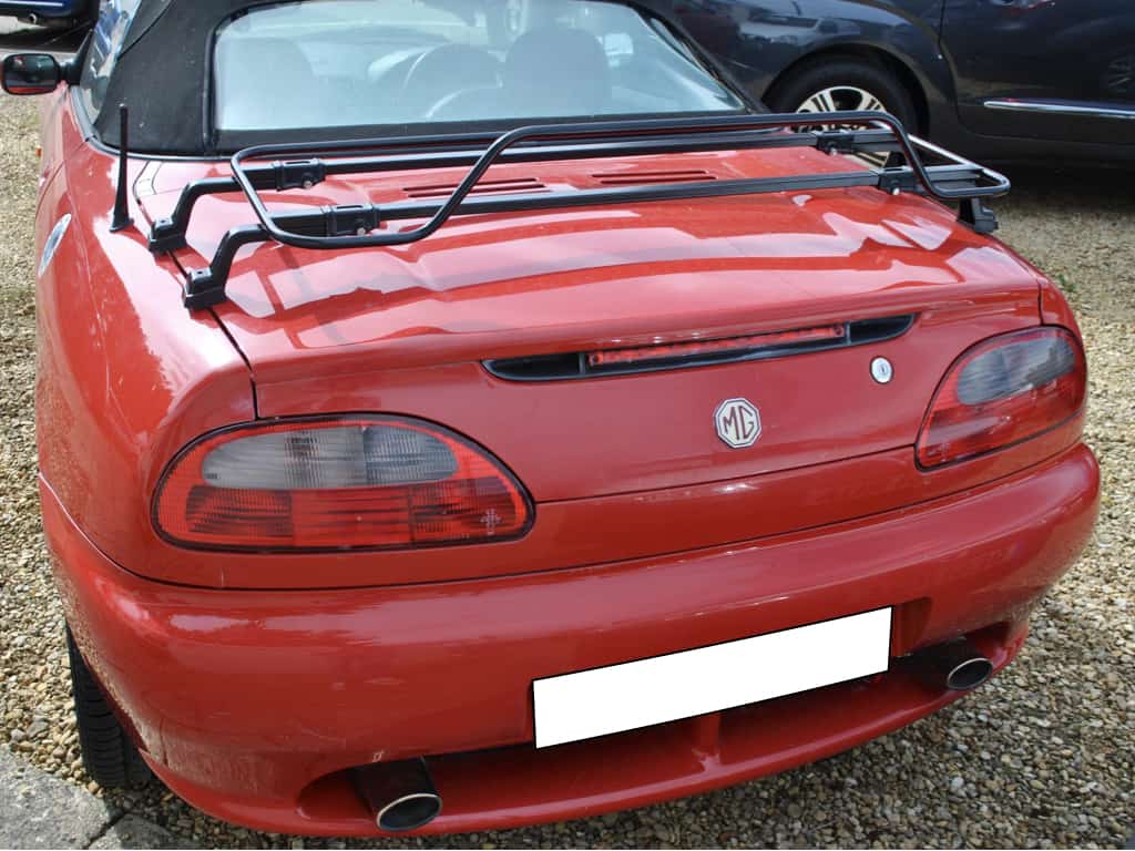 Red MGF with Italian black luggage rack attached with black hood up