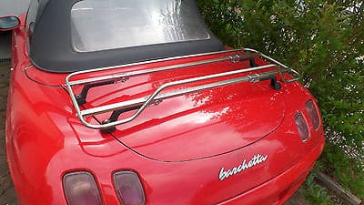 Red Fiat Barchetta with stainless steel luggage rack attached