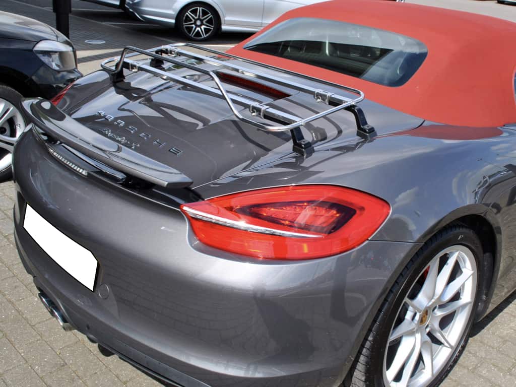 Dark Grey Porsche Boxster with red hood with stainless steel luggage rack attached