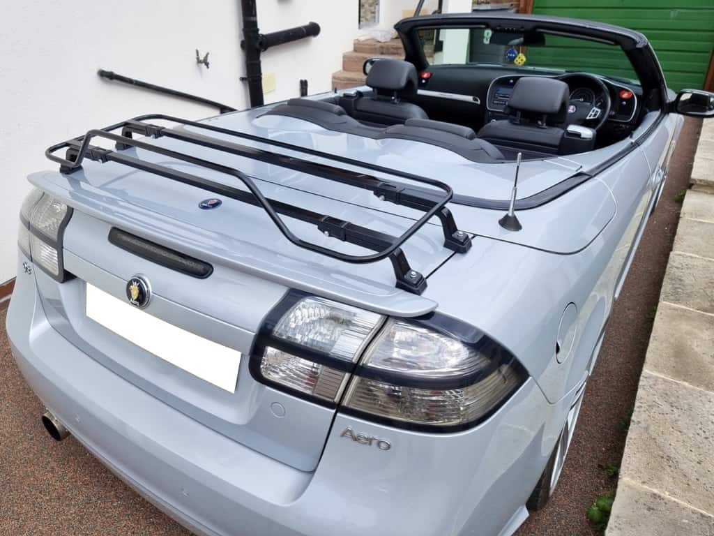 Pale blue Saab 93 convertible with black luggage rack attached
