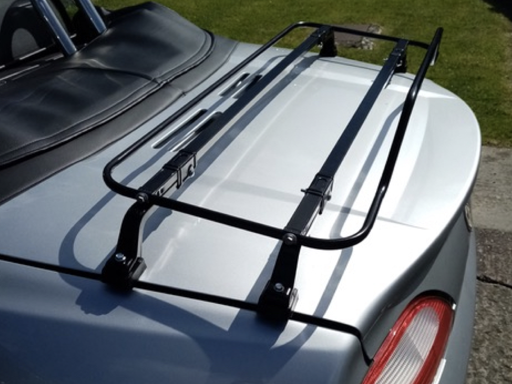 silver mgf with a black luggage rack fitted photographed close form the side